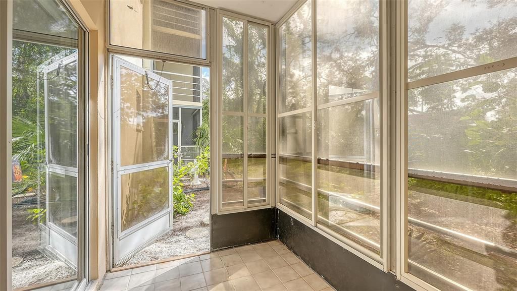 Screened lanai with door to go to the backyard