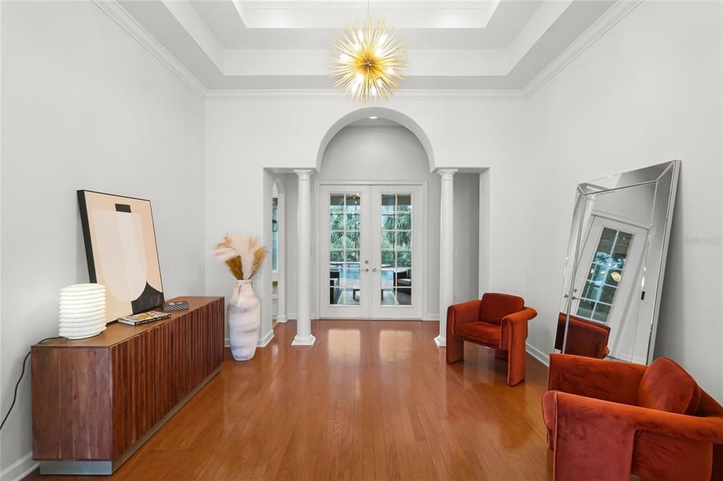 Living Room - BEAUTIFUL ARCHES, COLUMNS, TREY CEILINGS & FRENCH DOORS ADORN THE FORMAL LIVING ROOM.