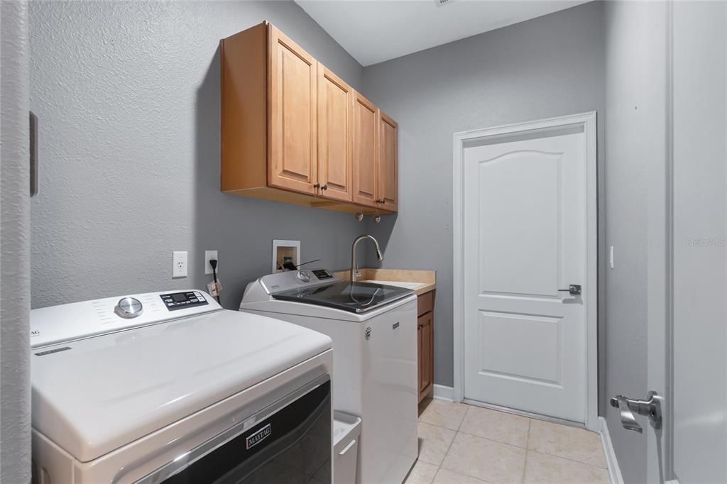 INSIDE LAUNDRY ROOM, OPENS TO 3 CAR GARAGE