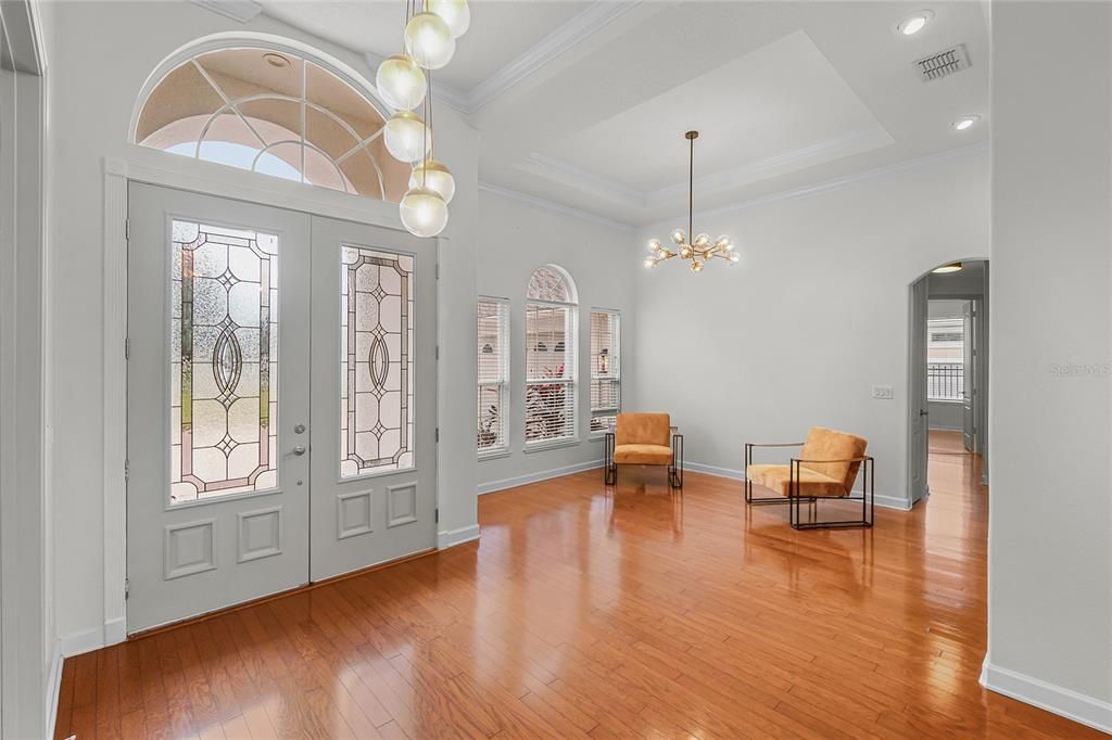 DINING ROOM - CHERRY WOOD FLOORS & LARGE WINDOWS LET THE SUN SHINE IN THE DINING & FORMAL LIVING AREAS.