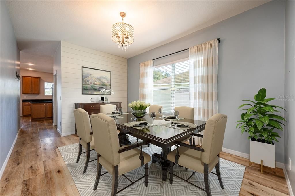 Formal dining area is perfect for gathering with family or entertaining friends. Virtually Staged.