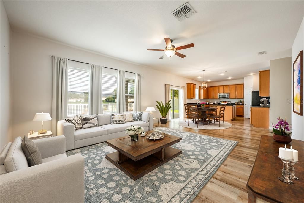 Follow the natural flow into the open kitchen, casual dining and family room all with a view of the gorgeous NEW POOL and water beyond! Virtually Staged.