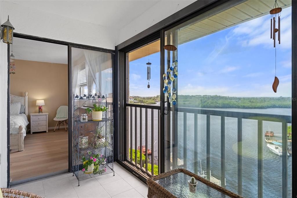 Enclosed lanai with direct waterfront view