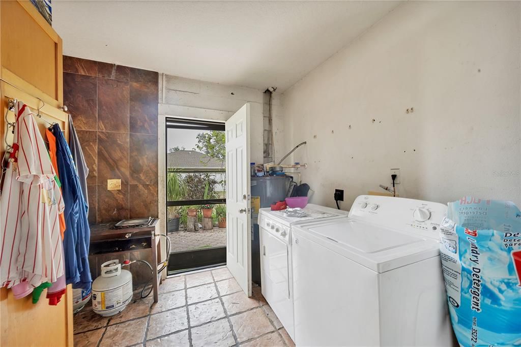 Laundry Room and a door leading to the back yard.