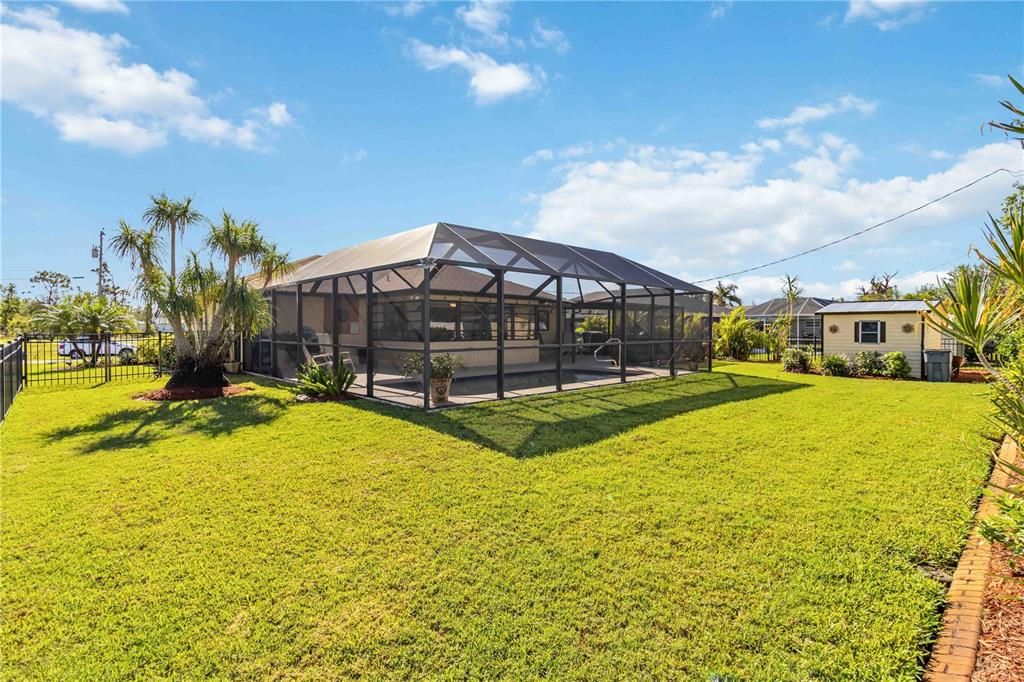 Lovely Yard! Tropical Landscaping to the right.