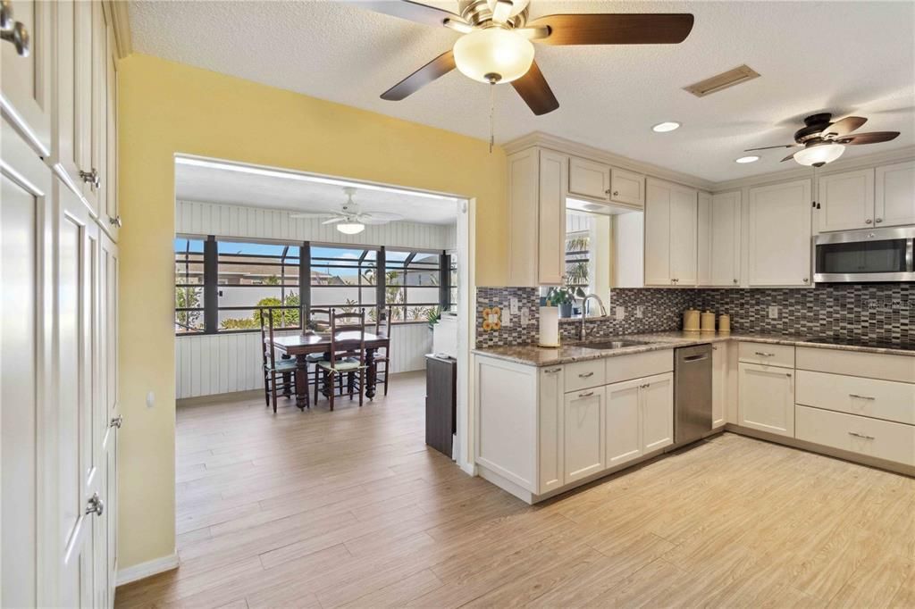 A wall of pantry cabinets on the left.