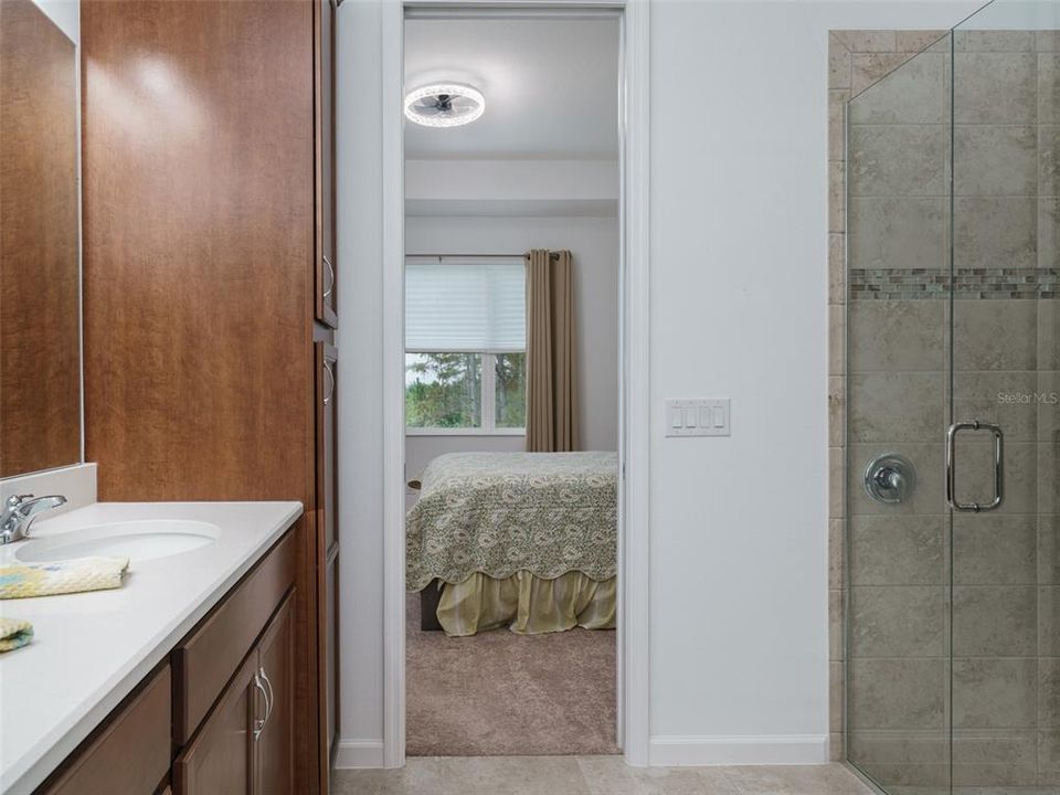 Pocket door closes the bathroom off from the primary bedroom.