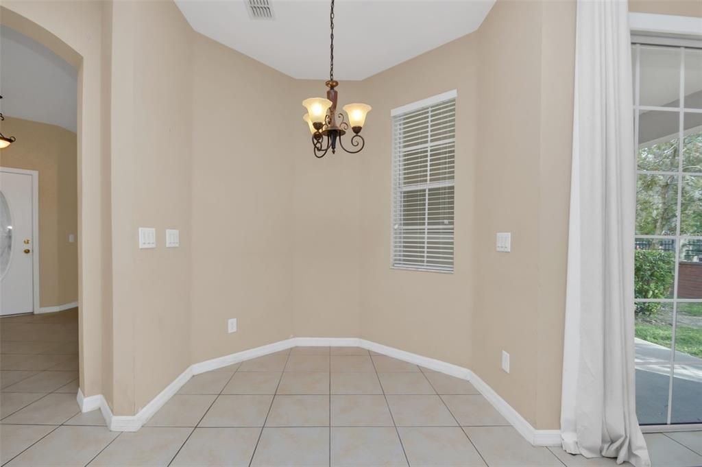 Breakfast eat-in area off kitchen and family room - open.  Sliding door opens to patio.