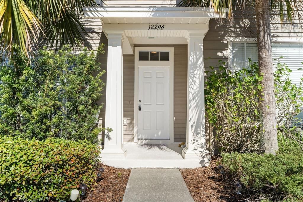 Beautiful entrance with mature landscaping