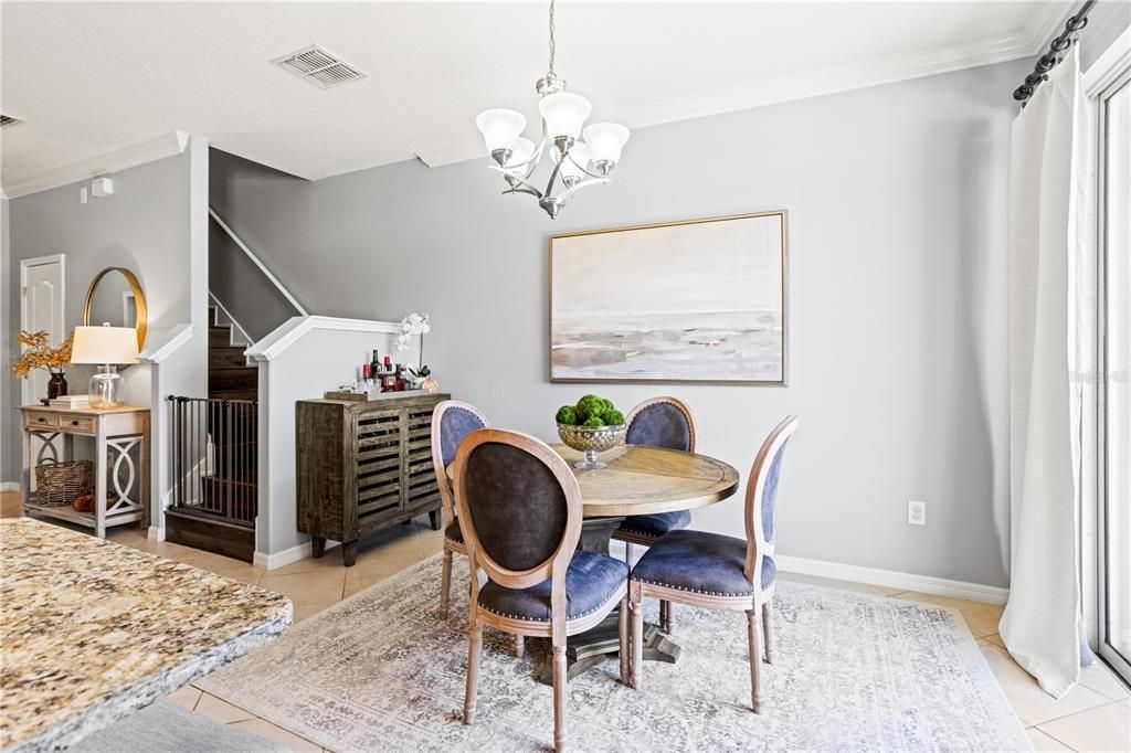 Dining area and view of stairs