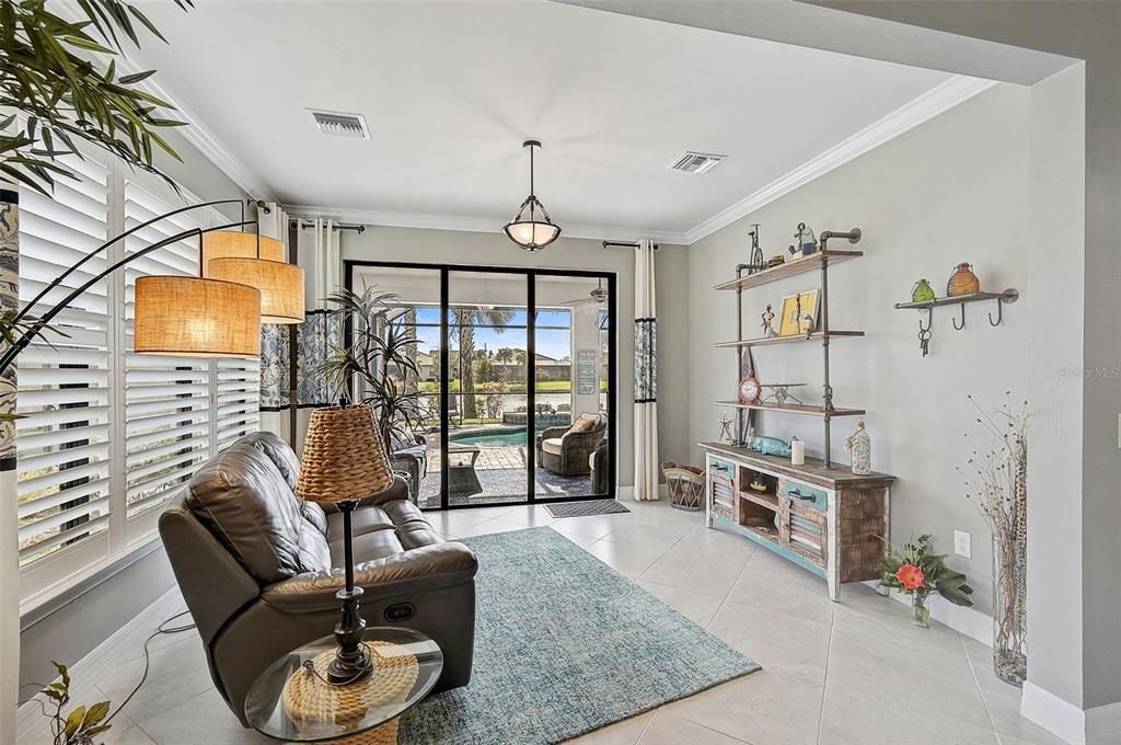 Additional Florida Sunroom off the main living area before going out to the pool area