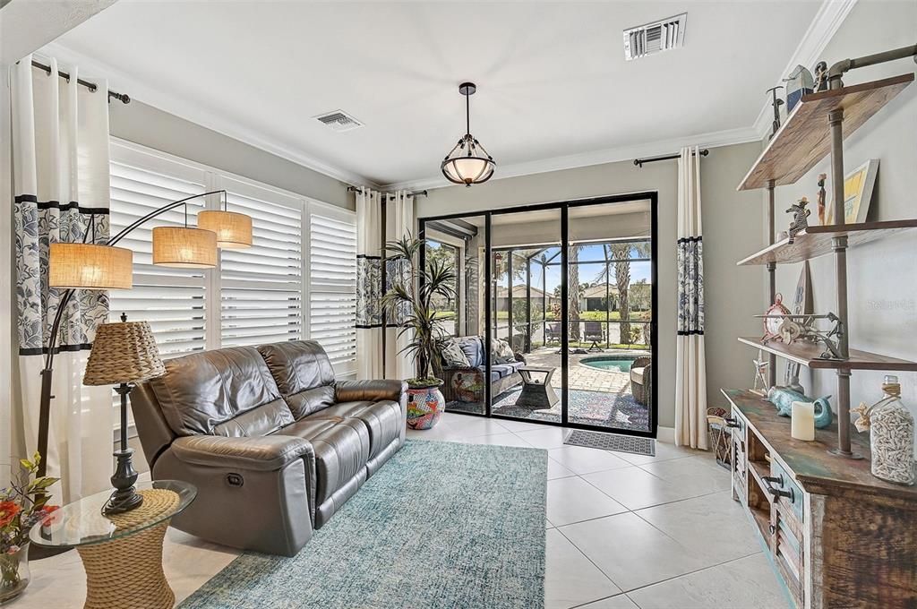 Additional Florida Sunroom off the main living area before going out to the pool area