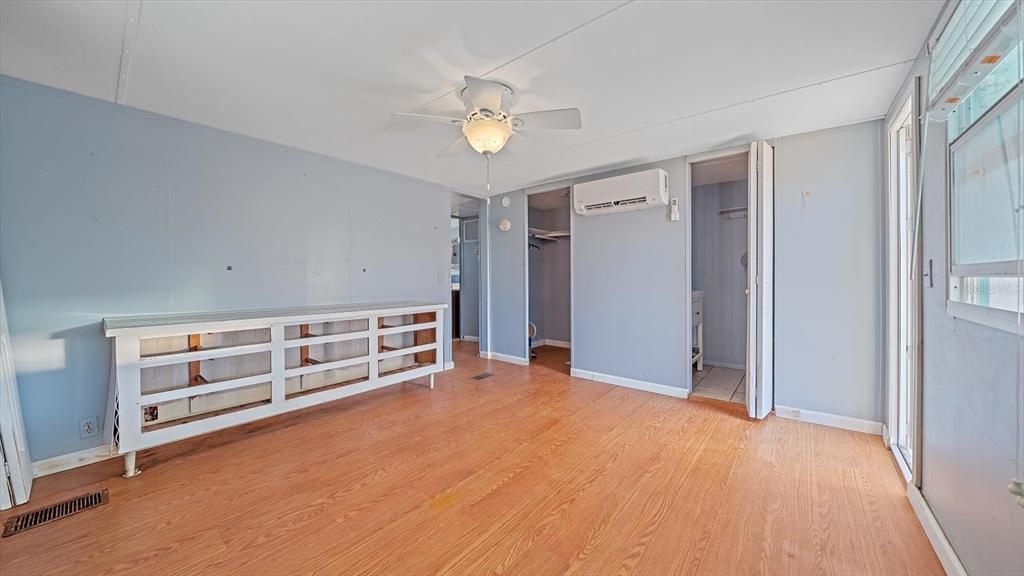 Primary bedroom with 3 closets, including walk in closet