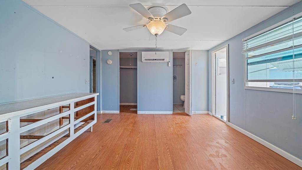 Primary bedroom with 3 closets, including walk in closet