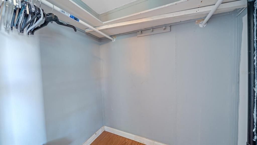 Walk in closet in primary bedroom