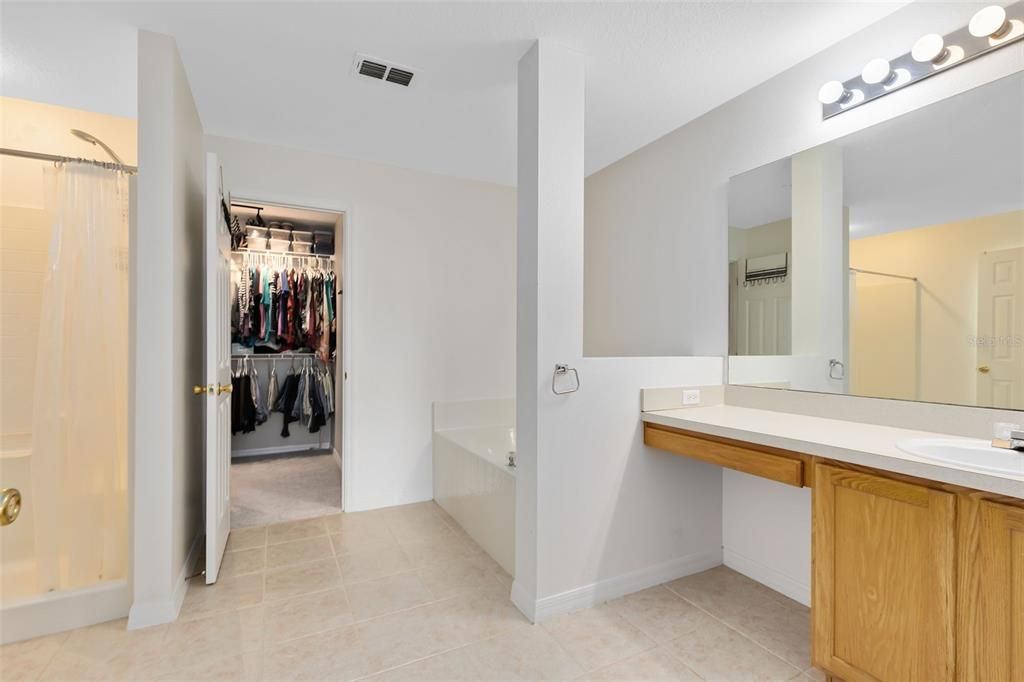 Primary ensuite bathroom. Separate tub and shower, walk in closet.