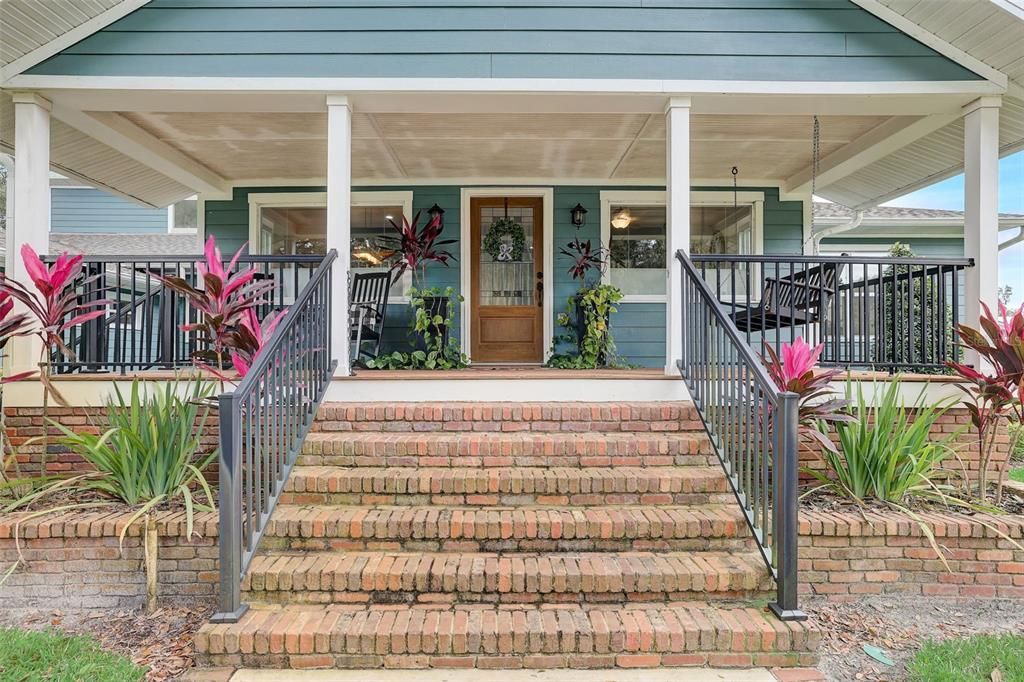 Welcome guests on this gorgeous front porch or enjoy front porch swinging