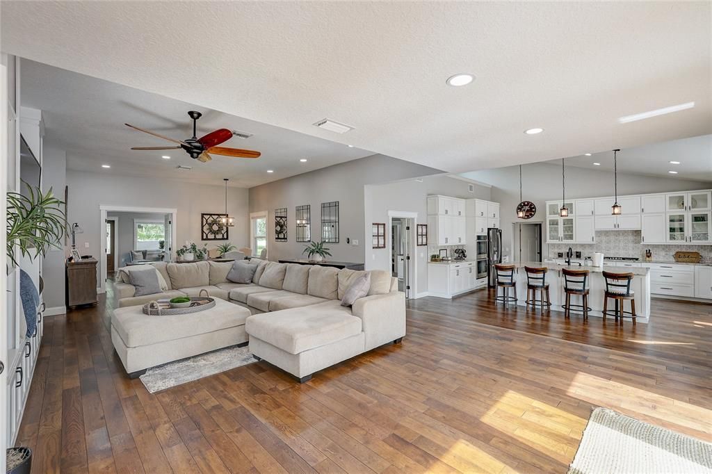 Open floor plan with family room and step down to gorgeous gourmet kitchen