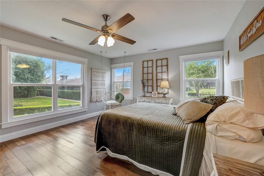 Enjoy this light and bright secondary bedroom in main home overlooking backyard.