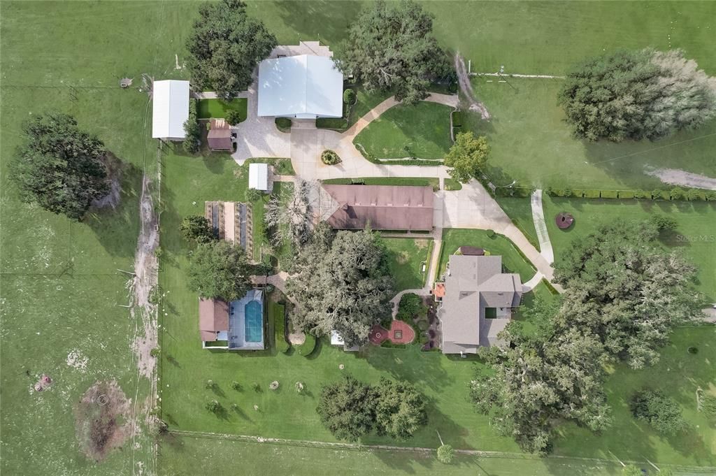 Imagine the possibilities with this sprawling estate that includes a primary home, wedding venue complete with outdoor and indoor venue, grooms room and bridal house with pool