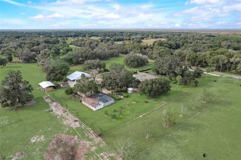 Looking from back of property towards the front is the bridal house with pool, primary house in front of that and reception venue with large white roof