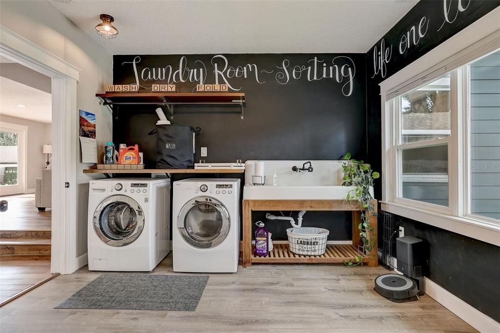 Imagine washing clothes in this cheerful room with lots of light and refurbished extra large farmhouse sink