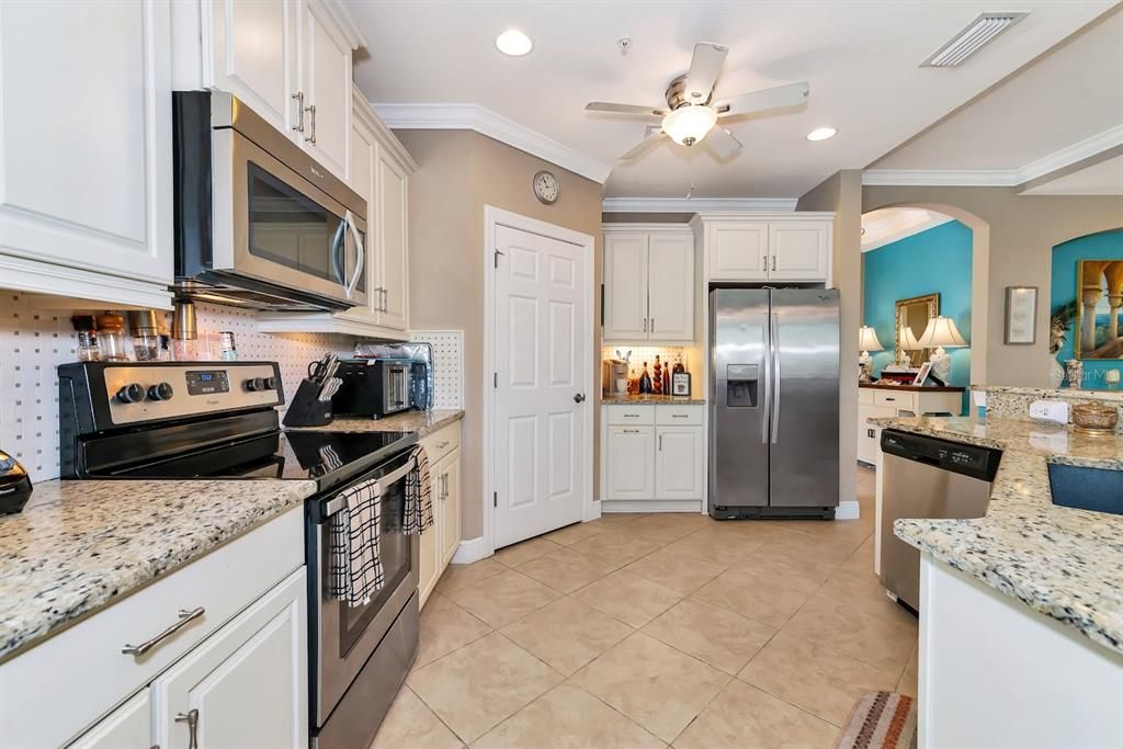 Kitchen with Granite Countertops, Corner Pantry, Stainless Steel Appliances, Wood Cabinets...