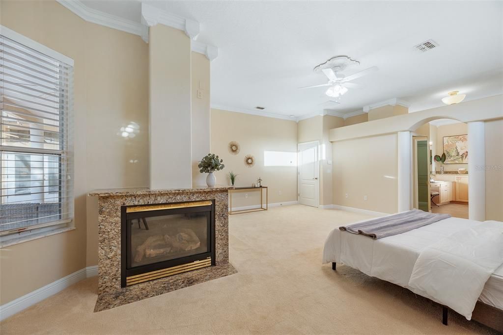 Enjoy this romantic gas fireplace from the comfort of your bed inside this luxurious Owner's suite.