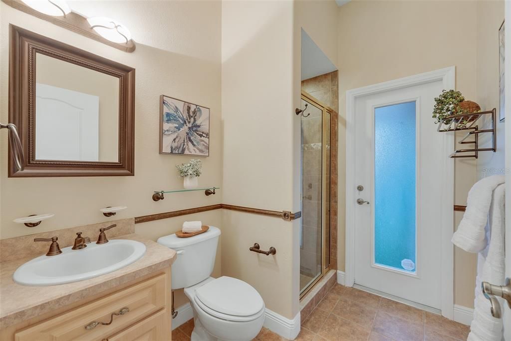 Bathroom #3 has a walk-in shower and doubles as a pool bath with convenient access outside to the lanai.