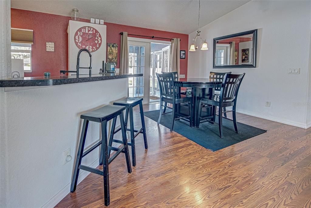 There is a lovely dining area with french doors that open to the lanai and pool area.