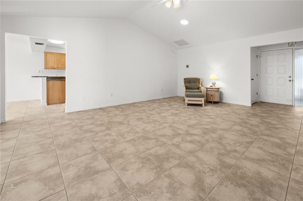 VIEW OF THE LIVING ROOM TOWARDS THE KITCHEN AND DINING ROOM