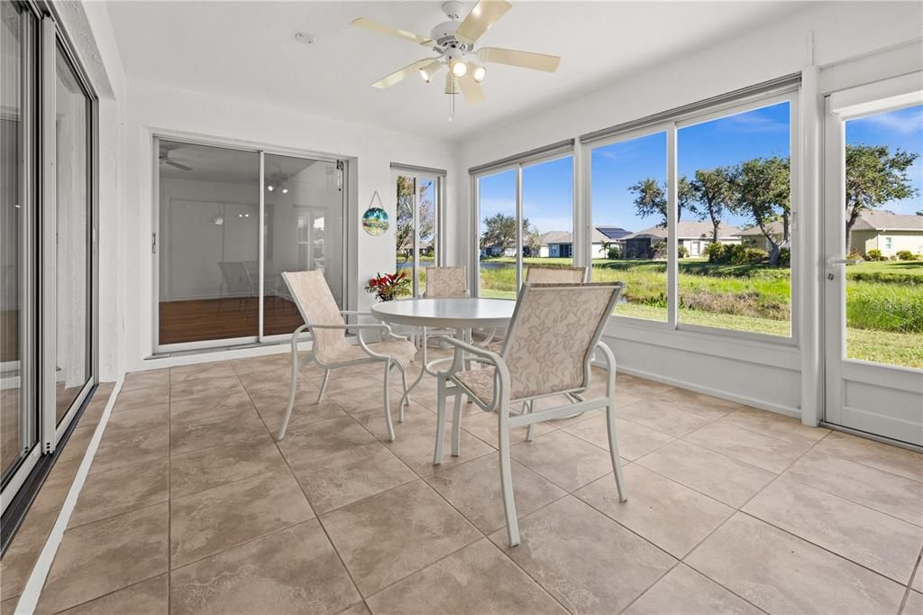 THE ENCLOSED LANAI OFFERS ADDITIONAL LIVING SPACE WITH LARGE WINDOWS