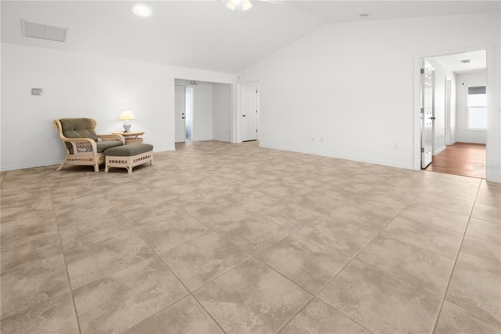 VIEW OF THE LIVING ROOM TOWARDS THE FOYER AND BEDROOM 2