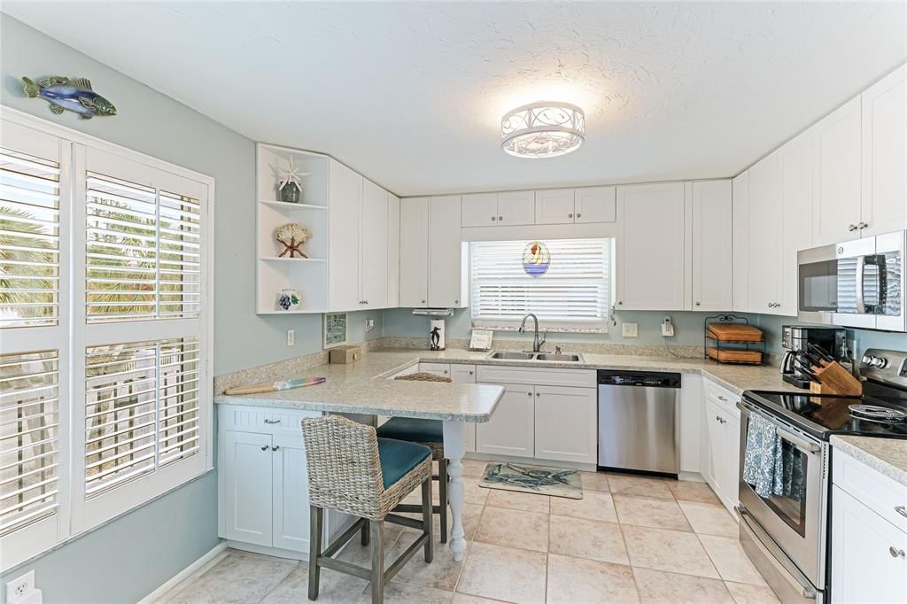 Spacious kitchen with a two seat breakfast bar