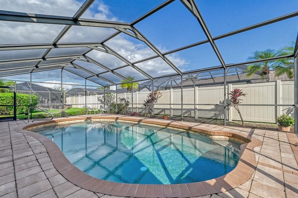 Beautiful Screened Pool and a Paver Deck