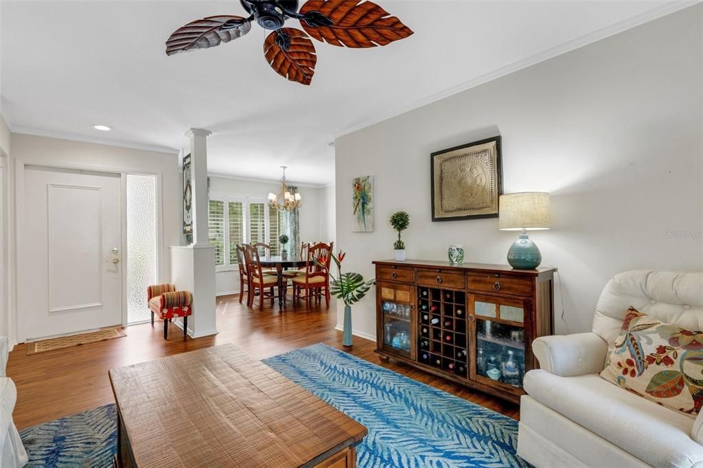 Wonderful living/dining room combo with plantation shutters throughout~