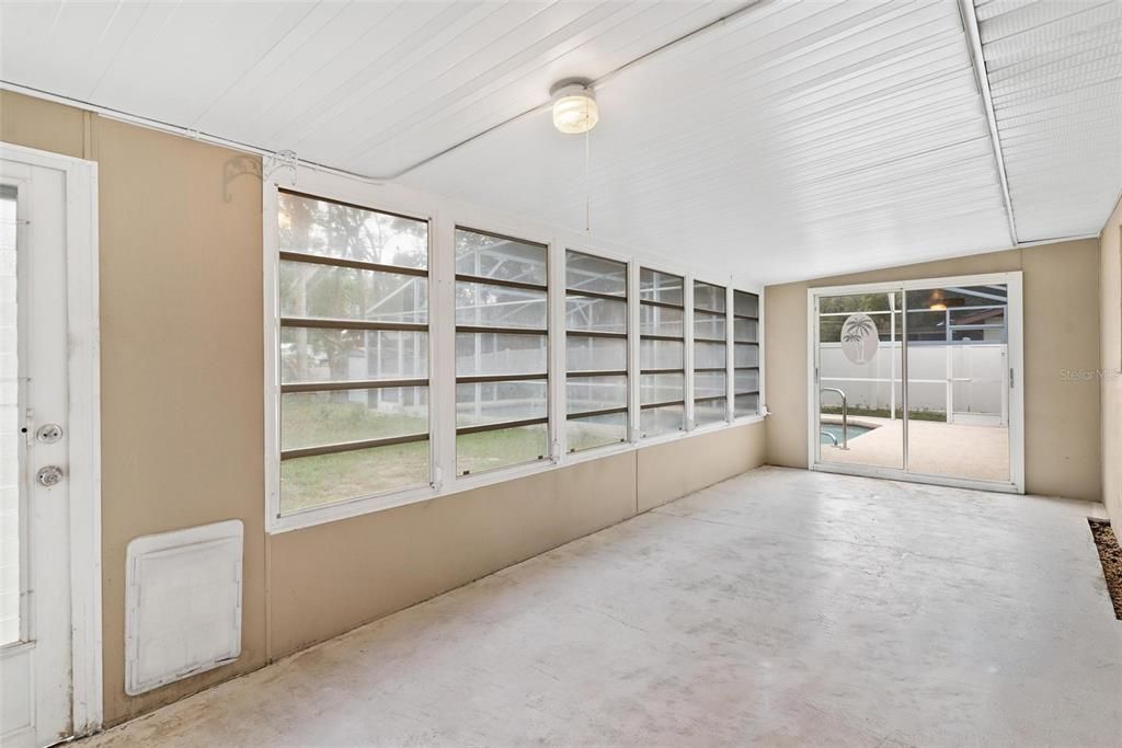 Lanai with Sliding Doors leading to Pool Area