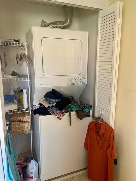 Laundry closet with new stackable washer/dryer