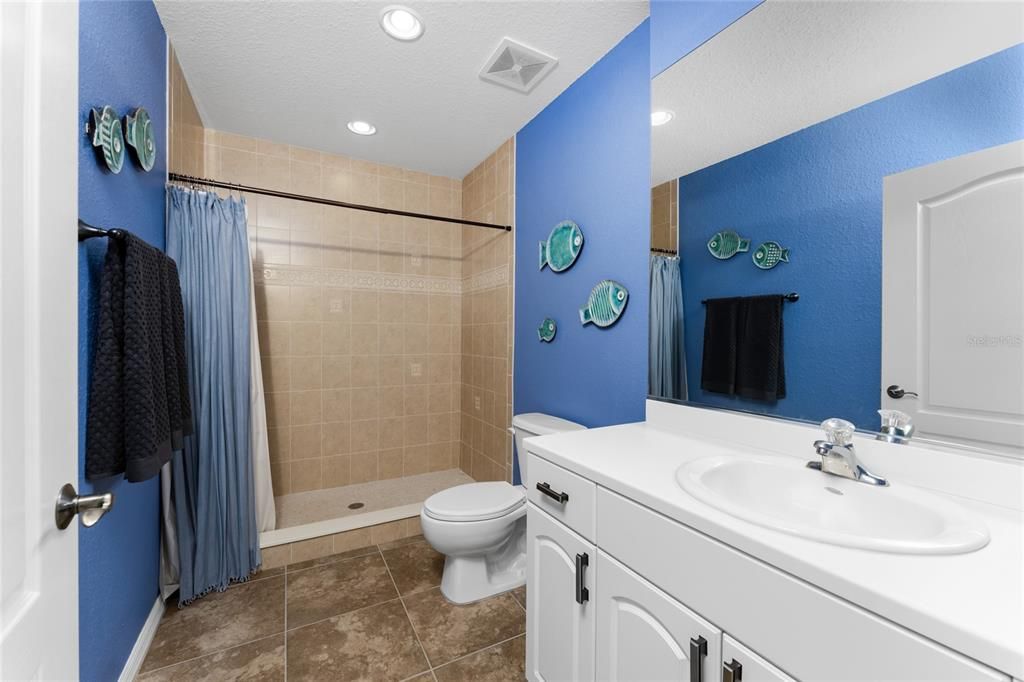 4th Floor Bathroom has Walk in Shower, Toilet and Sink with Vanity