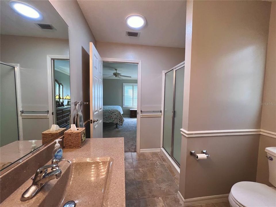 Ensuite bathroom toward primary bedroom