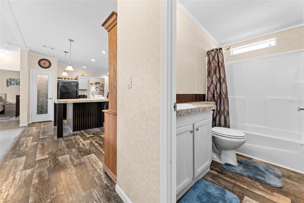 Primary bathroom with double sink and walk in shower