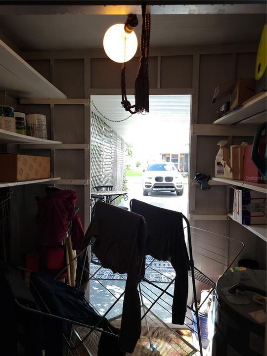 Laundry Room and storage under Carport.