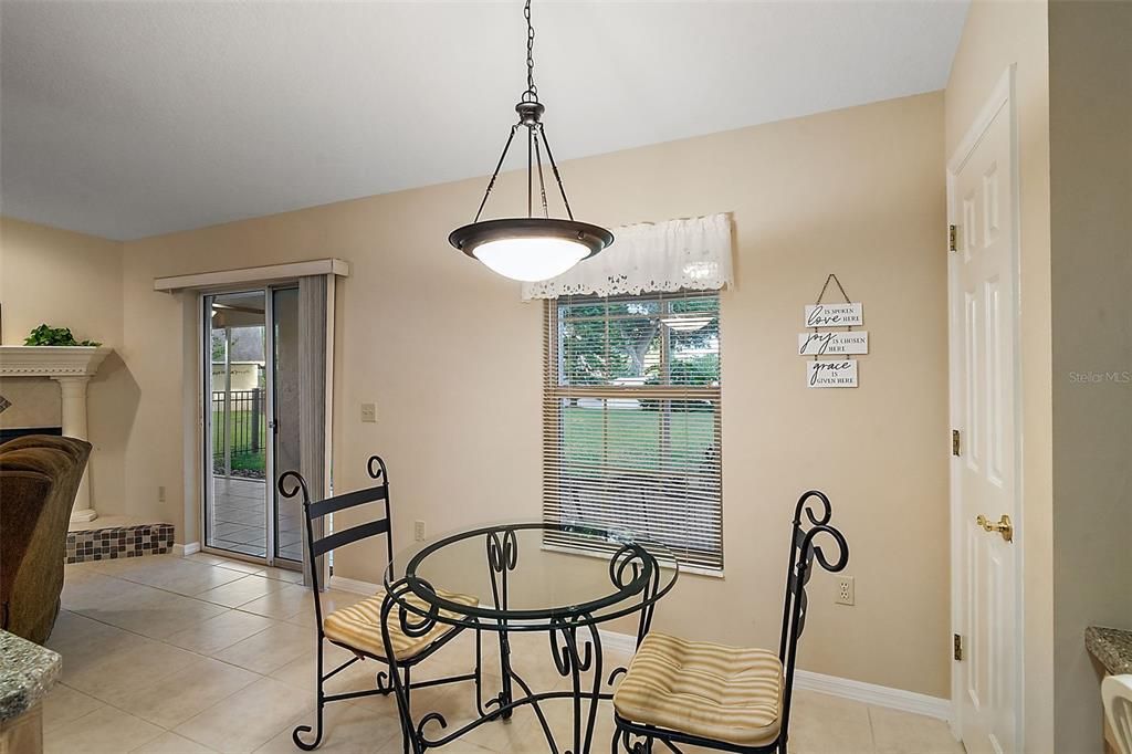 Dinette overlooks the fenced in backyard