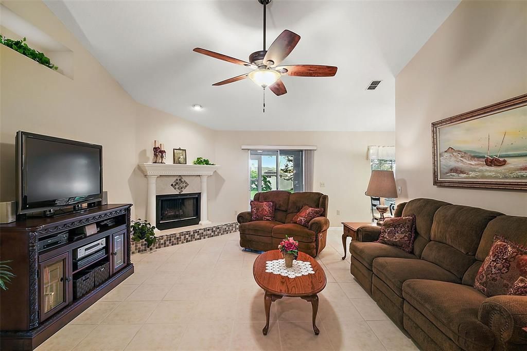 Tile flooring, vaulted ceilings, wood burning fireplace.