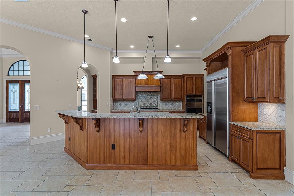 Kitchen open to family room complete with butler's area