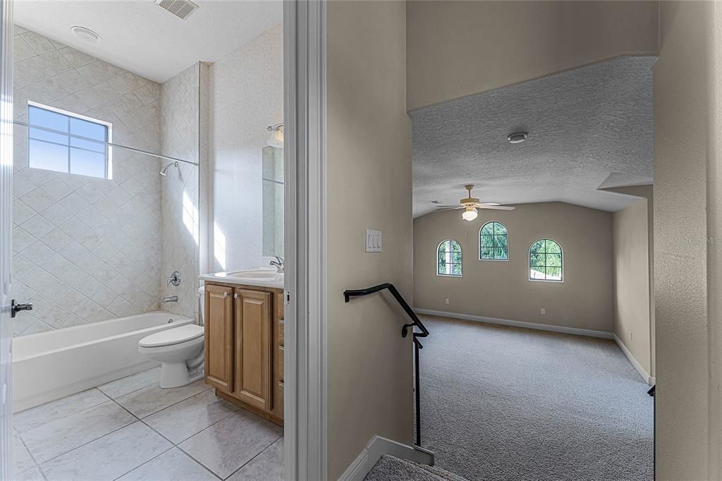 Hallway to bonus/5th bedroom and full bath