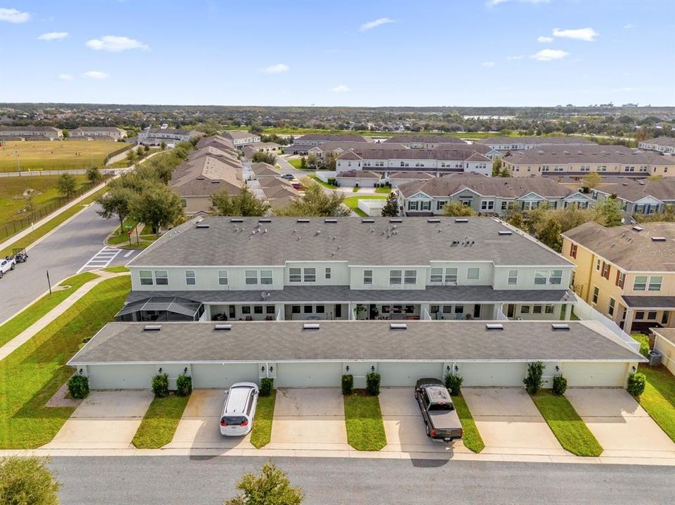 Aerial view of the property and community (back)