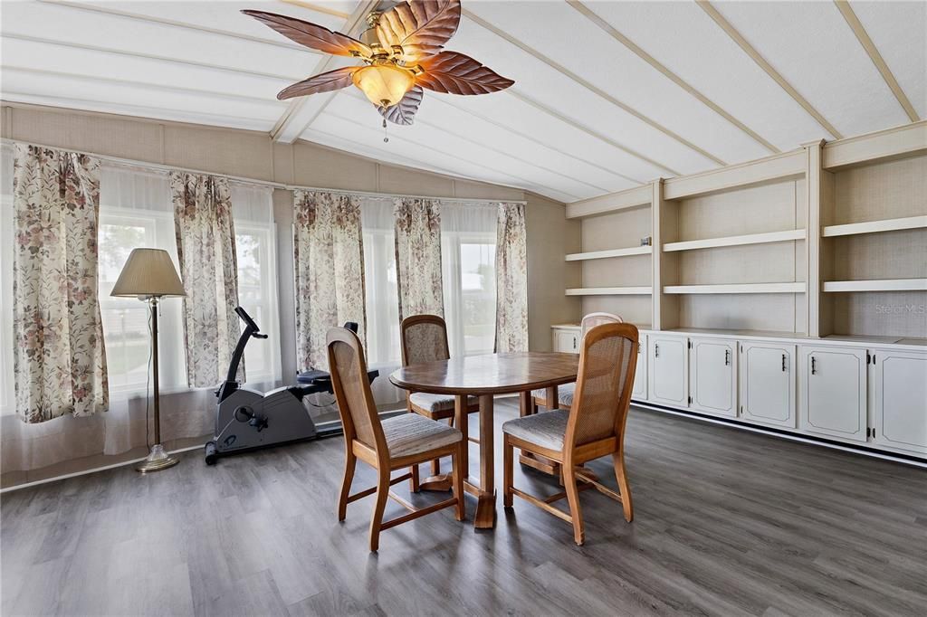 built in cabinets and shelves brings the dining area to life with plenty of storage space.