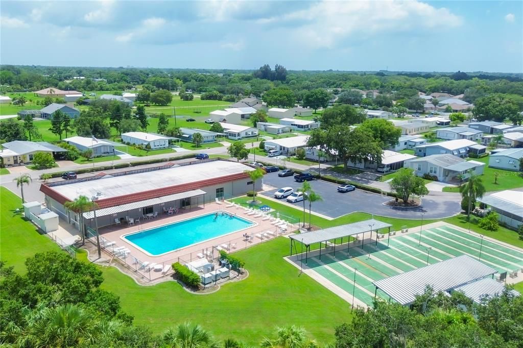 Aerial of the community pool, shuffle board courts and club house