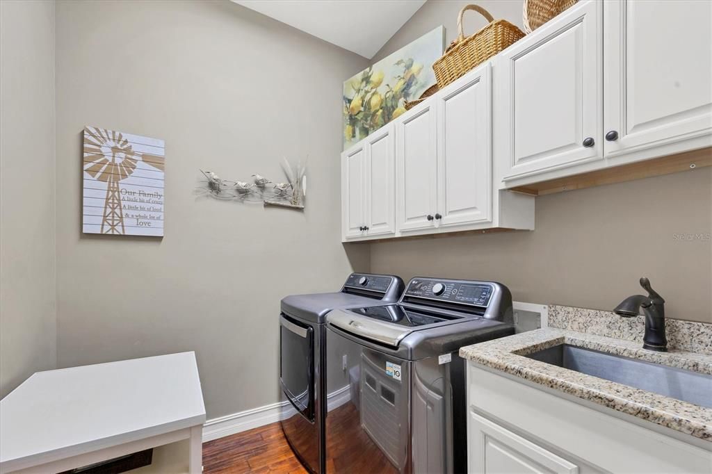 Indoor Laundry Room with counter and cabinets